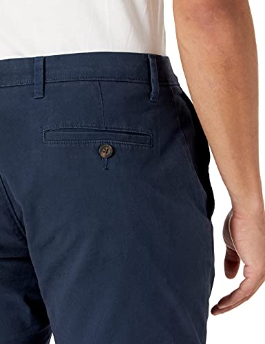 Amazon Essentials - Pantalones chinos elásticos informales de corte atlético, Marino, 33W x 28L